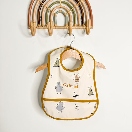 Babero con bolsillo Monsters