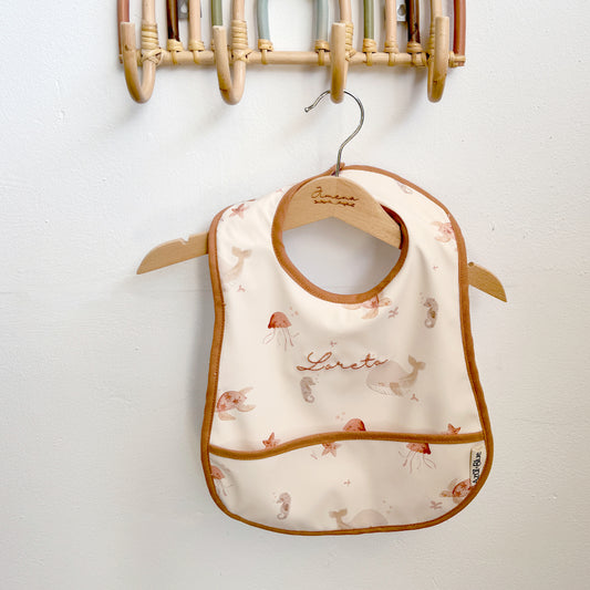 Babero con bolsillo Fondo Marino